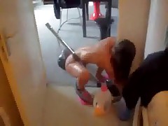 Skinny naked wife hoovering apartment wearing just a pair of pink slippers.